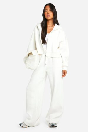 boohoo Dam DSGN Studio broderade joggers med vida ben | Ecru | Storlek Large
